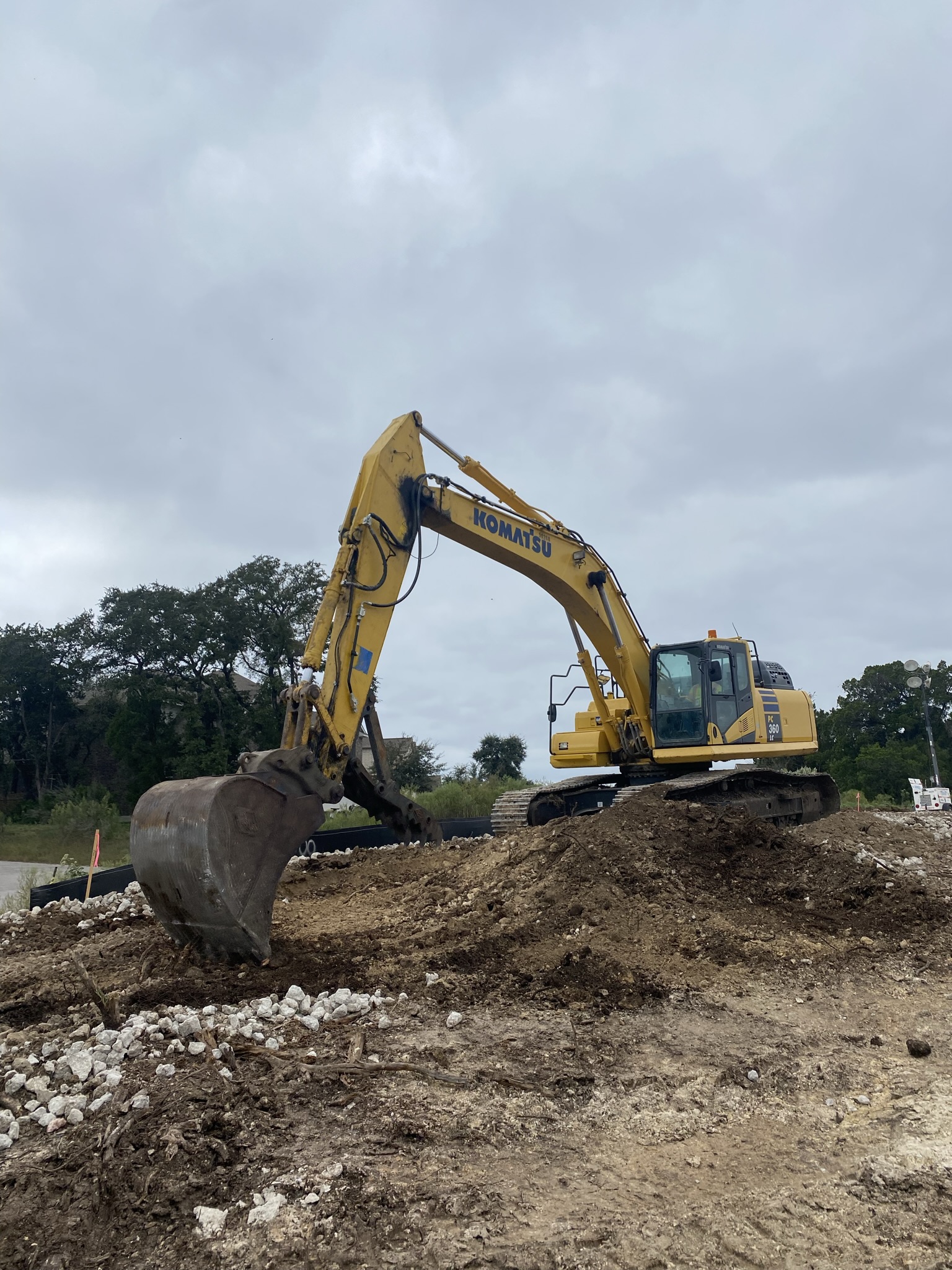 The team uses excavators to remove large amounts of dirt before grading activities begin in the US 290 West Segment. October 2021