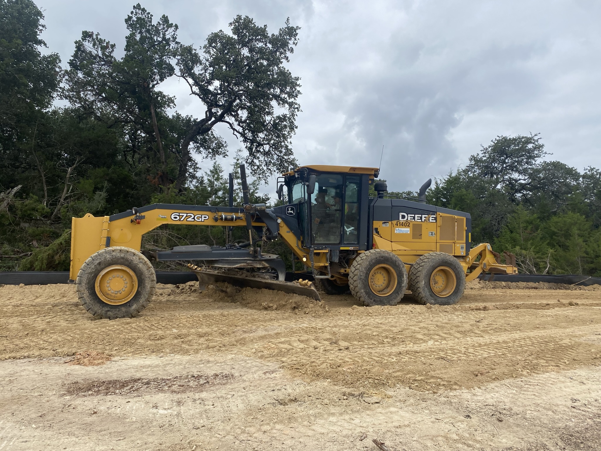A motor grader is used to create a smooth, wide-ranging, and level surface in advance of sound wall construction activities along the US 290 West Segment. October 2021