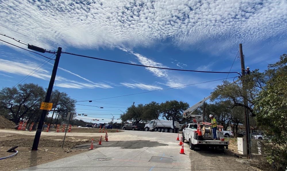 AT&T workers relocate a communications line on Mowinkle Drive near Circle Drive. This will become a signalized intersection in the project’s final design, and the relocation makes room for the placement of traffic signal poles. March 2022
