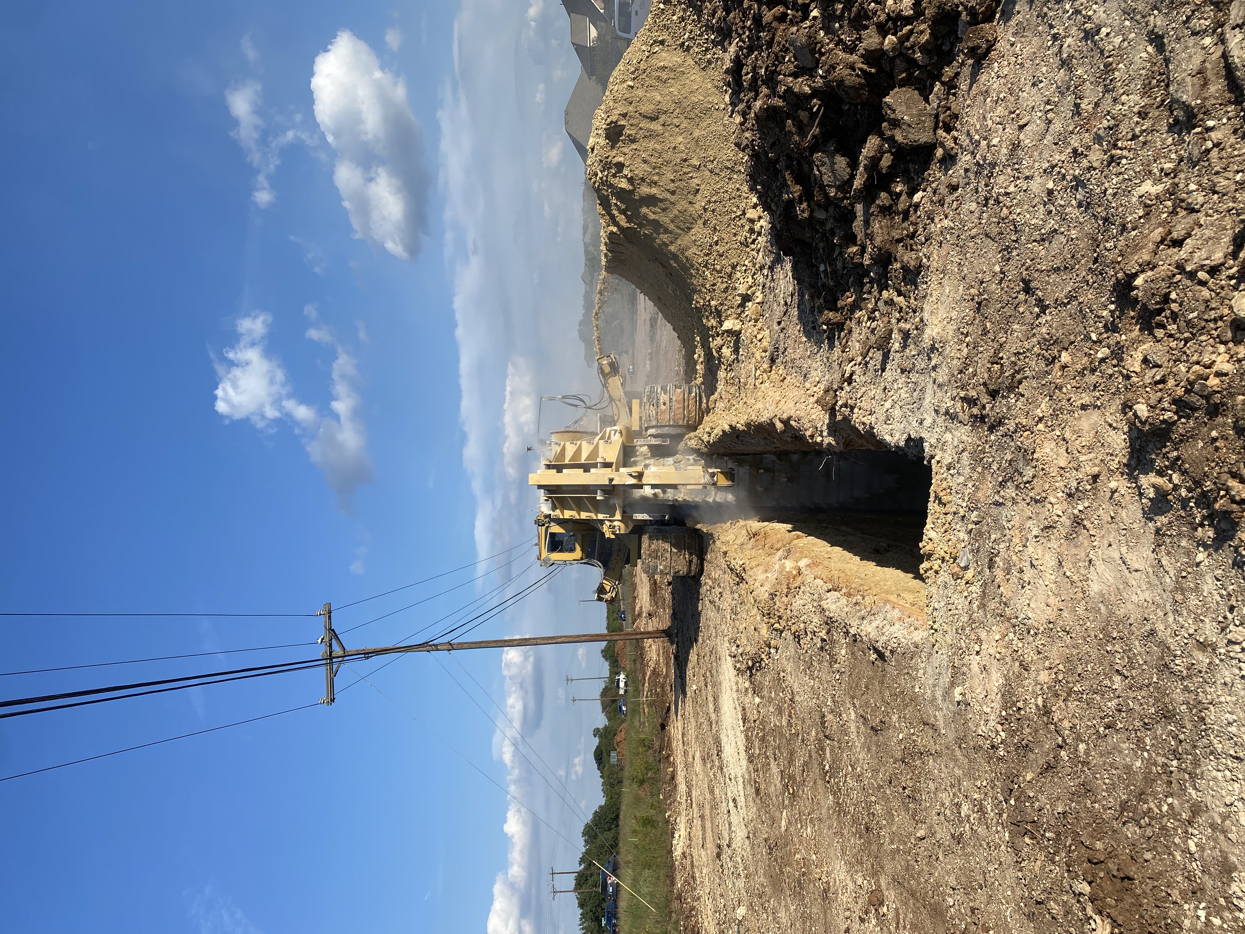 The team uses trenchers during utility relocations to install new pipes and lines underground. This trench being cut near South View Road will be used for a new City of Austin water line. November 2021