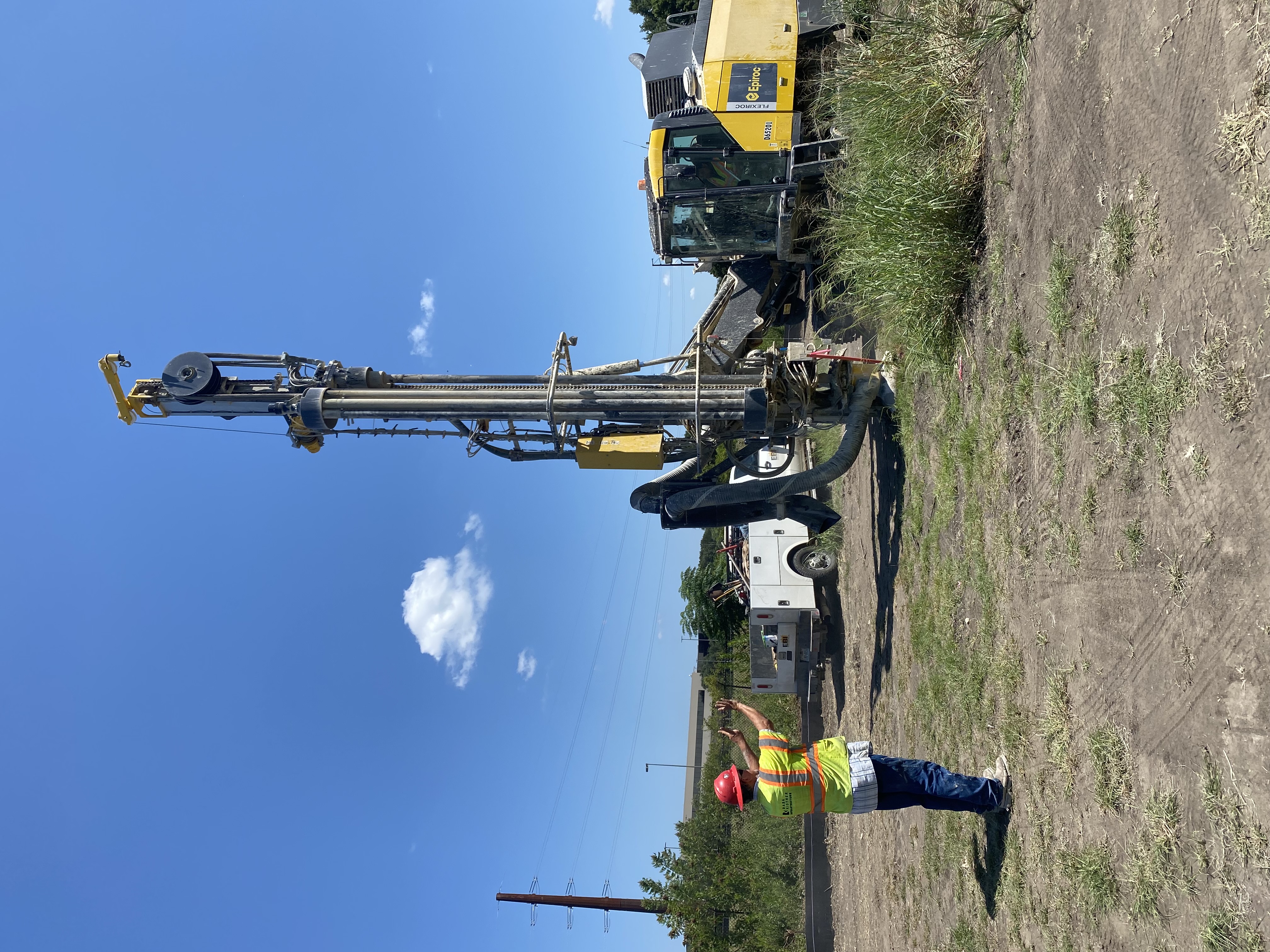 Crews move equipment into place to perform a drilling operation near William Cannon Drive, August 2021